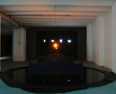 GATE 2010 installation cacaofabriek Helmond videoscreens/bed/lamp/oil
